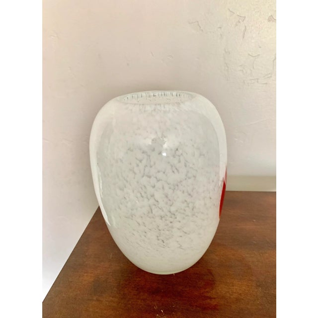 Beautiful minimalist modern white art glass vase with a single red flower and all over speckles design All over round...