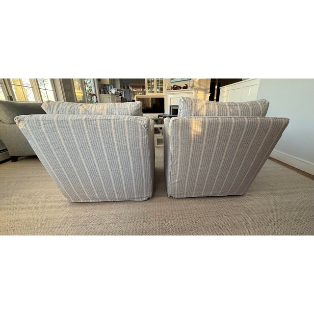 Pair of relaxed blue striped accent swivel in McQueen Delft Stripe Fabric. #FSF-27. Washable slip cover. These chairs have...