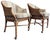 A beautifully designed pair of McGuire San Francisco Toboggan dining armchairs featuring sculptural rattan frames, woven...