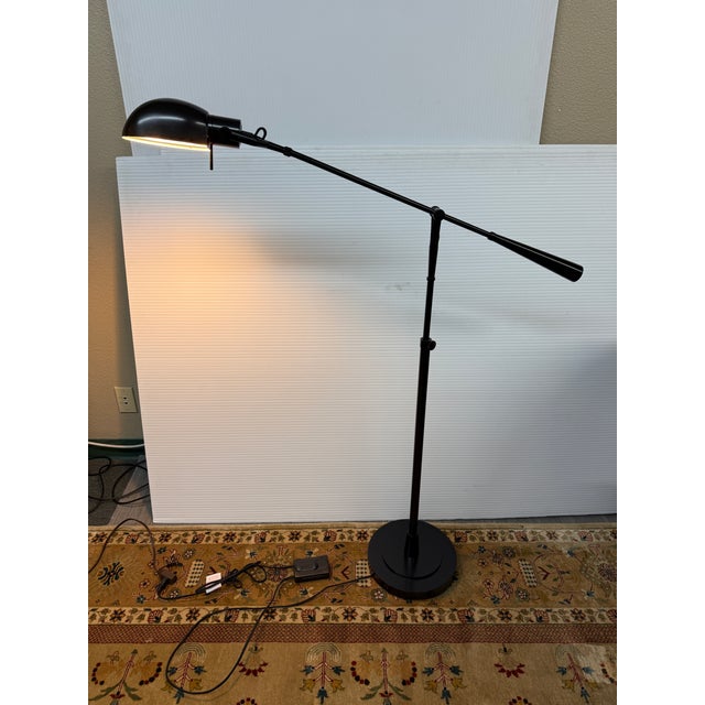 Design Plus Gallery presents an Equilibrium Floor Lamp from Ralph Lauren. This adjustable floor lamp pairs a...