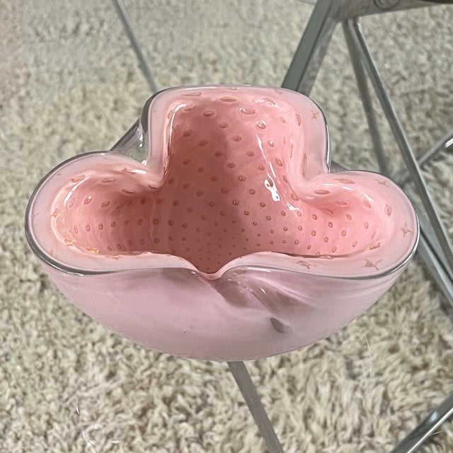 A sensuous shape with subtle decoration, this Murano glass bowl by Alfredo Barbini features pink cased glass with...