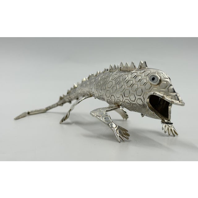 A striking articulated lizard sculpture by celebrated Mexican designer Emilia Castillo, created in Taxco, Mexico, during...