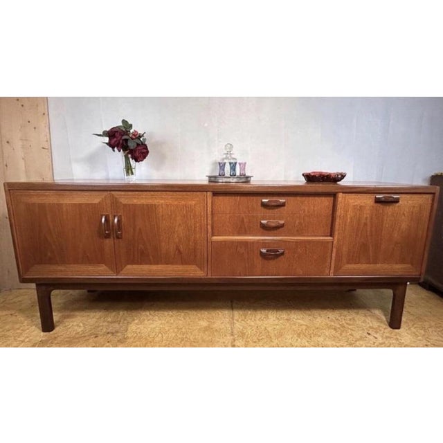 A stunning mid-century modern teak sideboard from the highly sought-after sierra range by g plan, dating back to the...