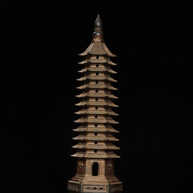 Bring a sense of zen and architectural history to your space with this striking vintage-style bronze pagoda sculpture....