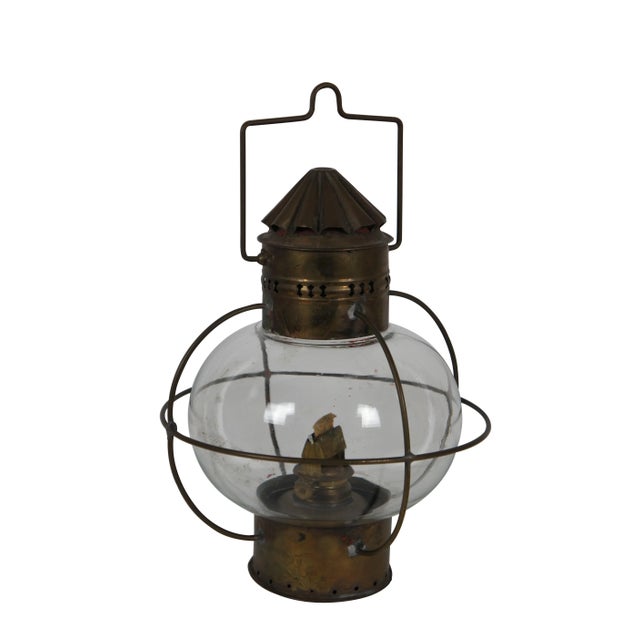 Pair of two antique Sherwood & Wedge "onion" navigational lamps featuring a cylindrical brass base, pierced top and fluted...