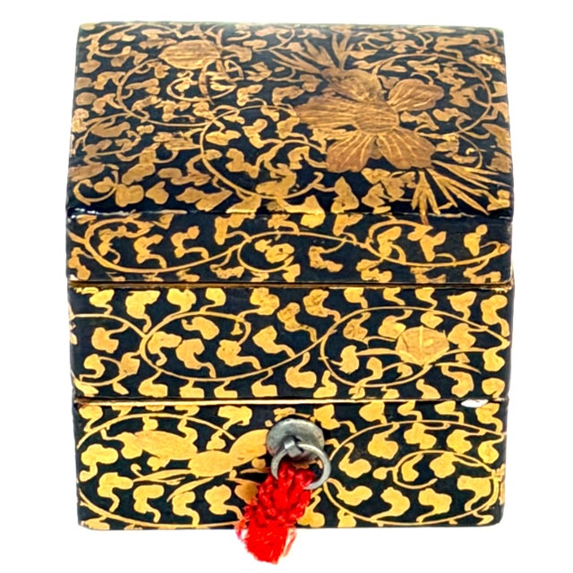 Japanese Meiji Miniature Gold Maki-e Two-Tier Jūbako, circa 1890 A diminutive Japanese Meiji-period stacking box, or...