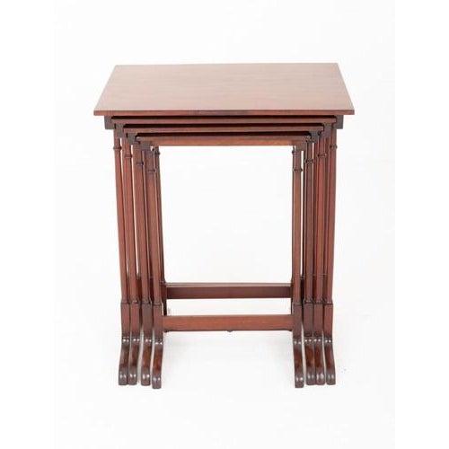 Fine quartet of Regency Revival mahogany nesting tables Each table is supported by elegant turned columns and raised on...