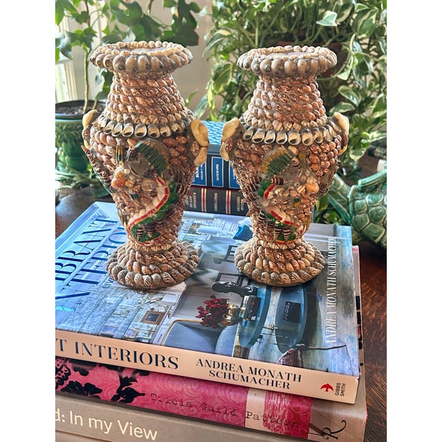 A wonderful pair of mid-century shell-encrusted coastal vases dating to the 1950s. These sculptural pieces are entirely...