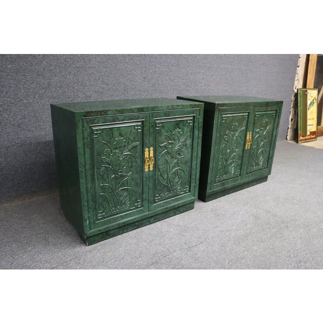 Striking pair of Henredon cabinet servers finished in a rich faux malachite green. Each features embossed floral panel...
