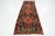 This Vintage Heriz wool rug has a blue and rust field with multicolor accents all over the design. This rug measures...