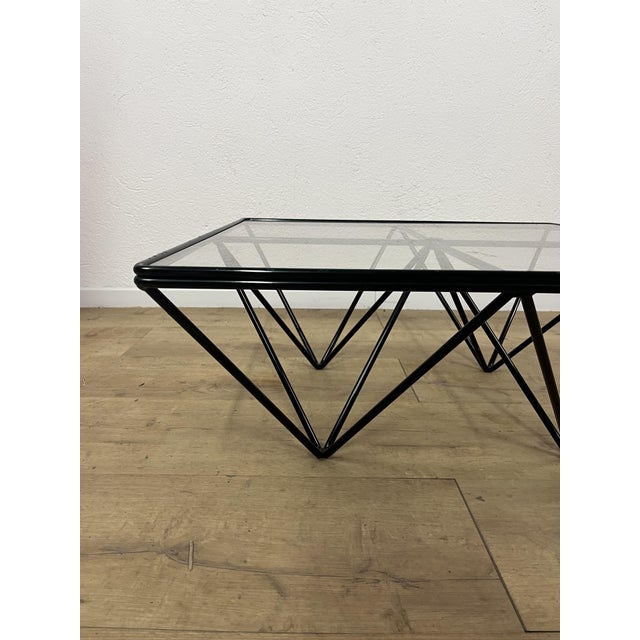 Alanda square coffee table with a black painted iron frame and glass top, designed by Paolo Piva for B&B Italia in the...