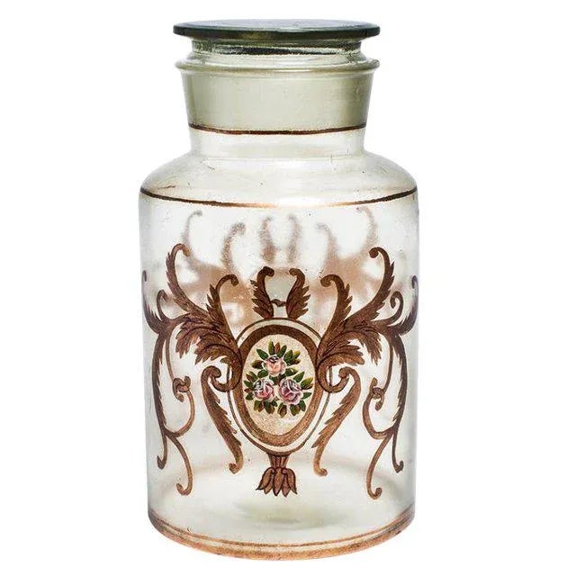 Fanciful lidded canister jar from Italy. Embellished with hand painted pink roses and gilded accents. Use this glass jar...