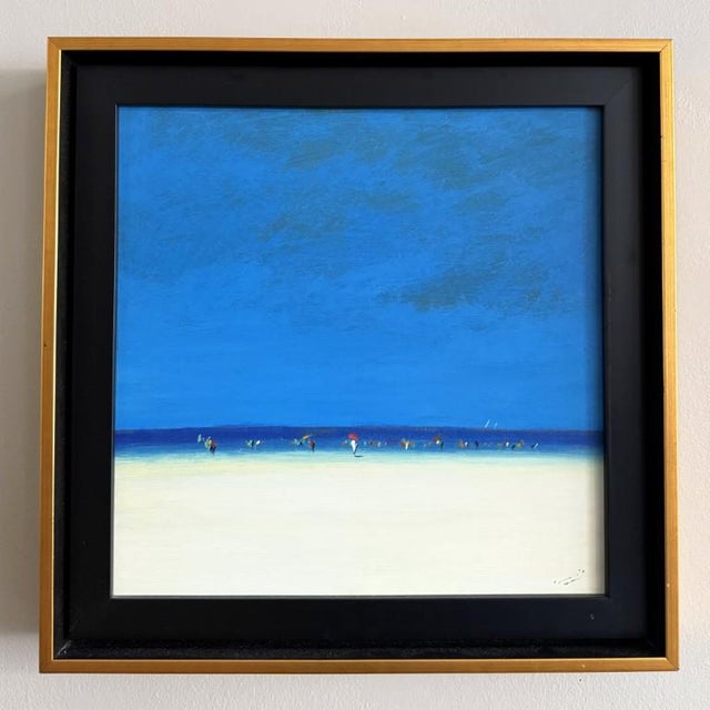 This minimalist blue horizon beach scene oil on canvas features expansive bands of sky, sea, and sand, punctuated by...
