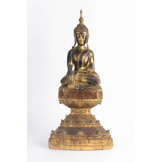 19th-century lacquered and gilded wooden sculpture of a seated Buddha. 19th-century lacquered and gilded wooden sculpture...
