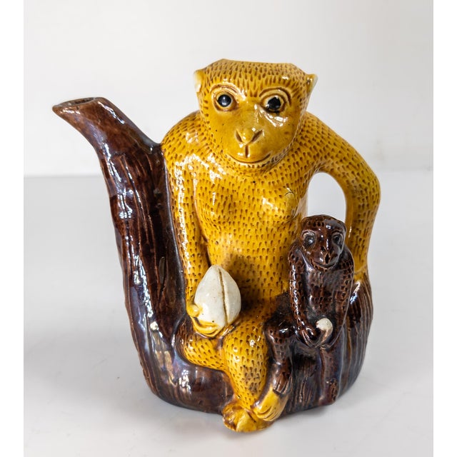 We are selling this cool Chinese early 20th century teapot. This teapot has great form with a monkey and smaller monkey...