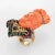 Elaborate and finely detailed cocktail ring depicting Guanyin (circa 1960s) crafted in 14 karat yellow gold. Coral is...
