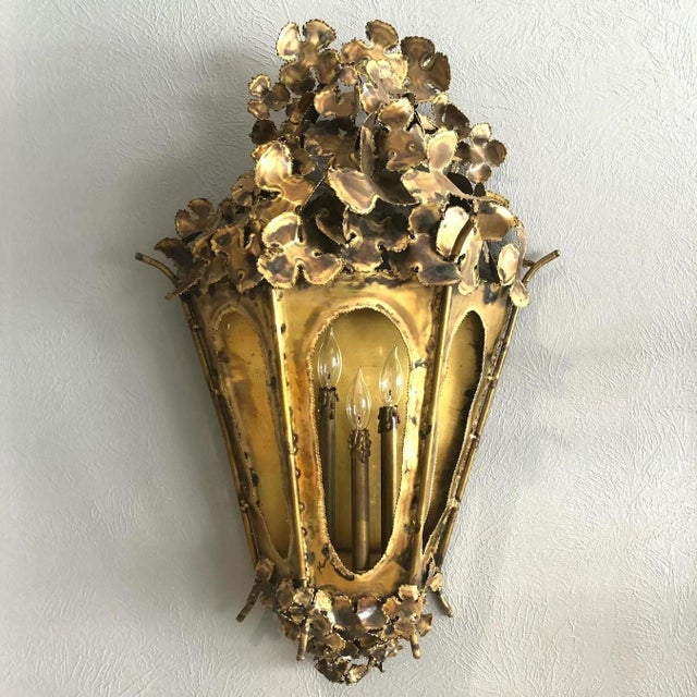 Unique 1960's brutalist welded solid brass wall mount lantern. The top and bottom are embellished with abstract...