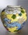 A very nice vintage famille jaune vase using enamels in blue, brown, green, white and rose, depicting dragons and foo...