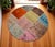 This sophisticated circular patchwork rug is a contemporary masterpiece composed of meticulously selected vintage...