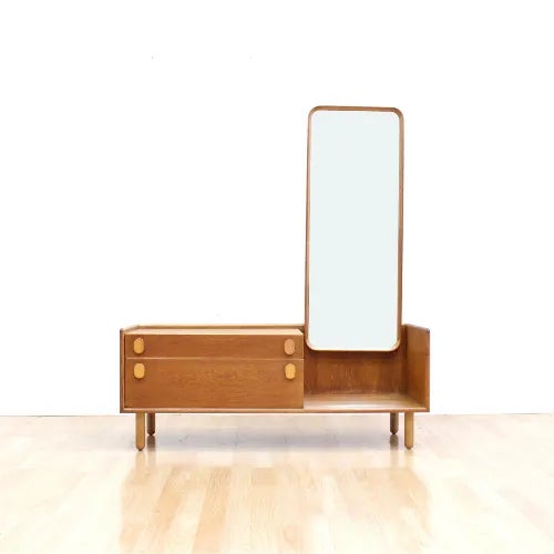 This mid-century vanity dresser was produced by Meredew of Letchworth in Hertfordshire England. Made from oak during the...