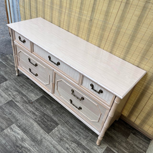 Vintage Hollywood Regency Faux Bamboo Dresser by Broyhill. Circa 1970s Features a faux bamboo frame with a washed finish,...