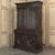 A distinguished 19th century French hunt style bookcase, hand-carved from solid oak and inspired by the grand country...