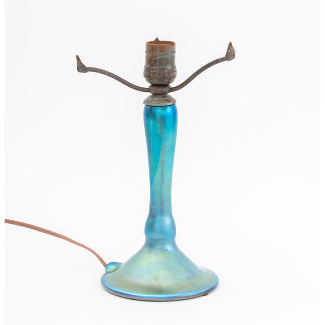 Lundberg Studios Iridescent Blue Art Glass Table Lamp Base, 1983, with three lily pad form verdigris patinated bronze...