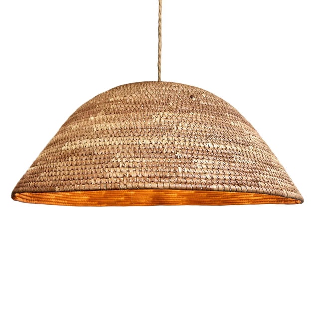 Vintage woven basket from the Dogon tribe turned into a unique pendant light. Each is uniquely handmade. These beautiful...