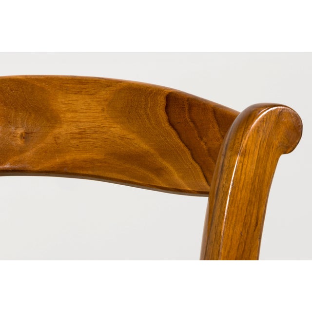 Sourced in Provence, France, this set of twelve French Louis Philippe style dining chairs is crafted from solid walnut and...