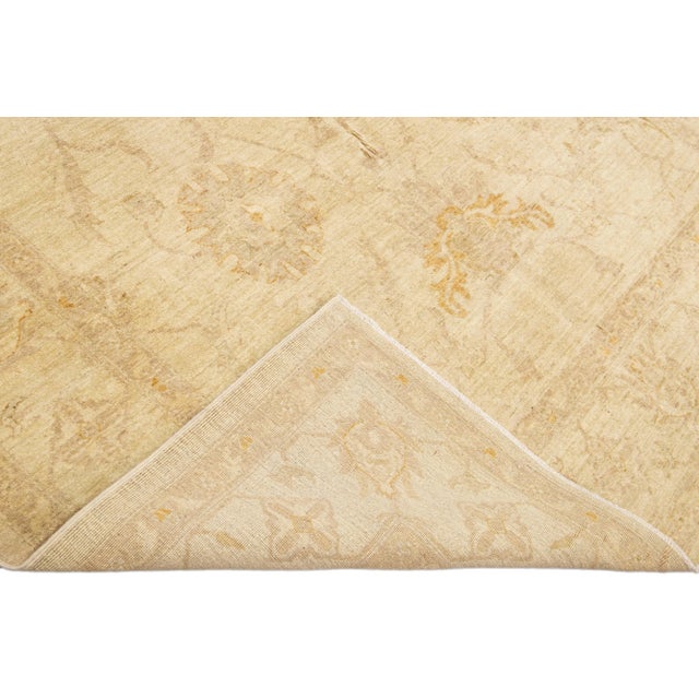 Beautiful modern Oushak hand-knotted wool rug with a beige field. This Oushak rug has brown accents that feature a...