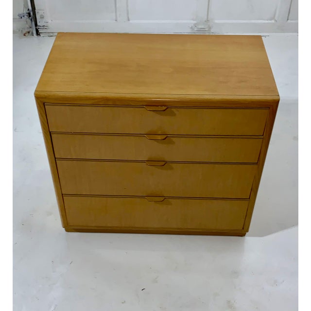 This dresser, in a light honey maple, was designed by John Van Koert, a prolific furniture designer who worked for Drexel...