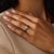 This elegant Mid Century diamond engagement ring is a timeless 1950’s design, centered by a GIA-certified old mine cut...