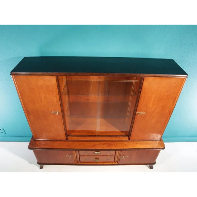 This original highboard from the 1950s consists of two components and is of high quality. The surfaces are refined with...