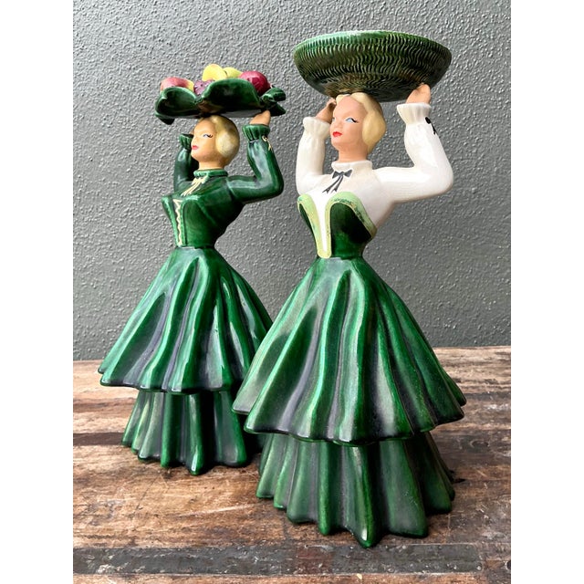 This charming set of two Mid-Century Modern ceramic figurines captures the whimsical yet sophisticated spirit of 1950s...