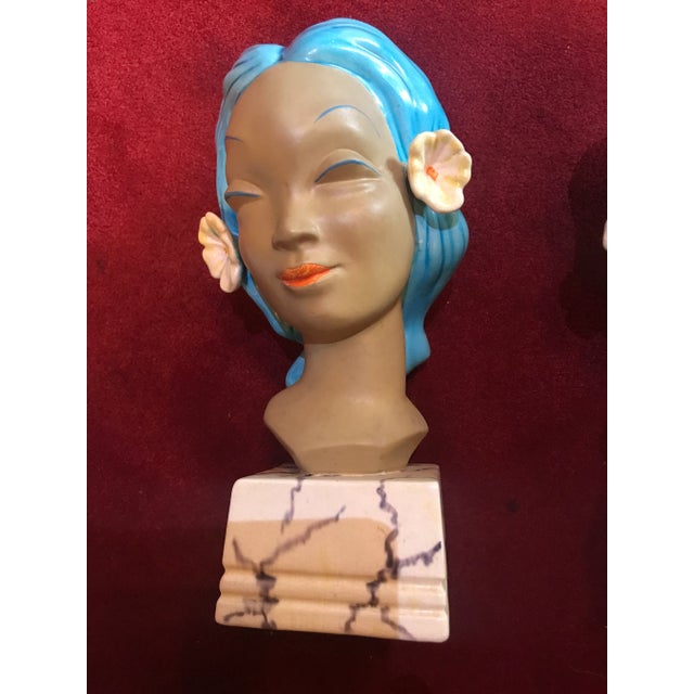 Pair of ceramic heads of island girls could be used as bookends 10” inches tall in perfect condition may need cleaning...