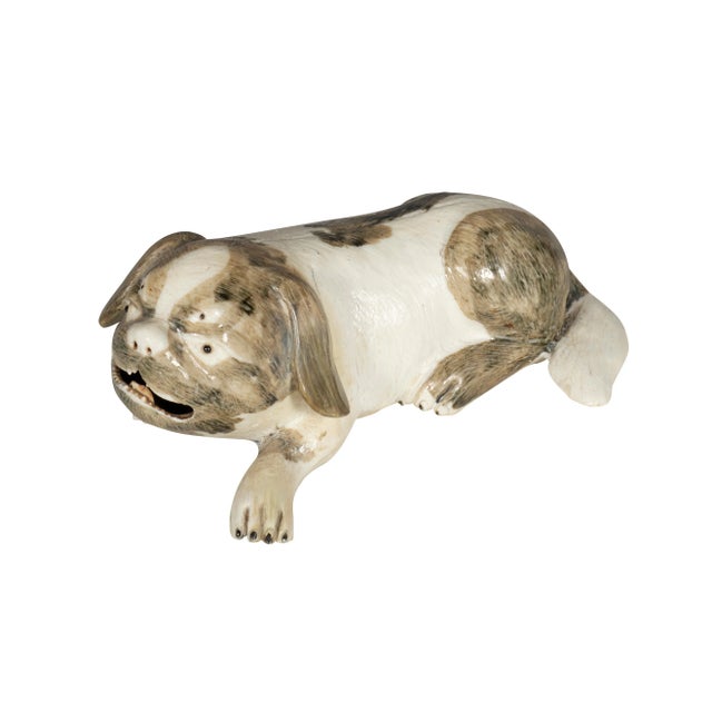 Well modeled "lion dogs'" modeled after a Pekingese the companion pet of Chinese royalty. Cream colored ground with brown...
