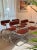 A Set of 4 Chrome Cantilevered Dining Arm Chairs in a Rich Rusty Red Boucle For Sale - Image 9 of 12