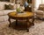 OLD CHAPEL HOME COLLECTION OLD WORLD TOBACCO WALNUT COFFEE TABLE WITH VERDIGRIS METAL INSET TOP A striking statement piece...