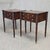 An elegant pair of antique mahogany Federal style nightstands with distinctive circular carved porringer corners and...
