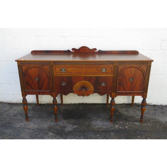 This wonderful Sideboard/Buffet is made out of wood, solid wood, mahogany, flame wood, burlwood, and veneer. The Sideboard...