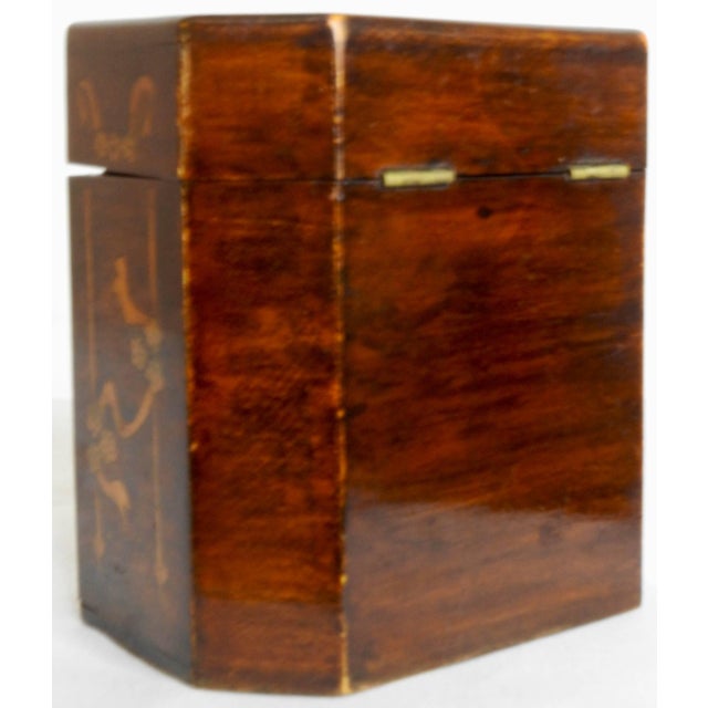 This beautiful tea caddy has extensive inlay depicting ribbon, floral, and birds. The canted corners on this box give it a...