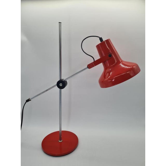 A vintage adjustable desk lamp manufactured in the former gdr (east germany) in the 1970s. A distinctive example of mid-...