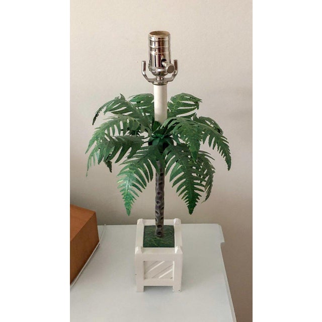A rare and stunning pair of Maison Baguès palm tree tole lamps in Chippendale planters. Each to the top of the socket, 21"...
