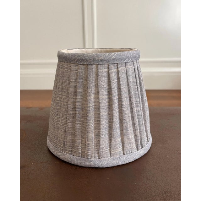 Gathered lampshade in light blue Fermoie "Blue Moire" linen. Balloon lined in cream cotton matching the frame color. 100%...