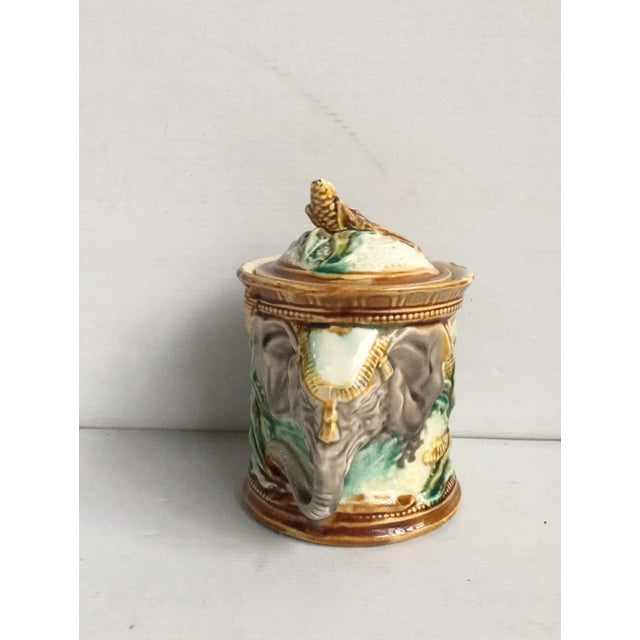 Majolica tobacco jar Onnaing, circa 1890. The two handles are elephants heads, decorated with corn, the handle of the jat...