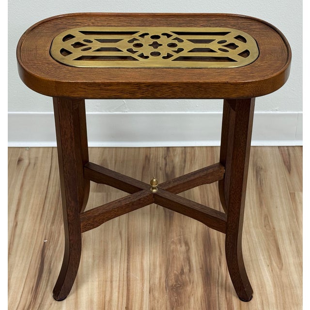 Late 20th Century oval wood side table with a brass fretwork insert. Originally thought to be a candle or kettle stand,...