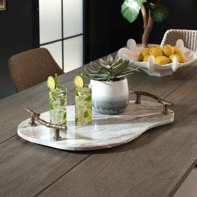 Crafted From Natural Marble, This Tray Has A Unique, Abstract Shape With Elegant Gray, White, And Rust-colored Veining....