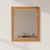 The Vintage irror features a orange-tone wood frame accented by a white zigzag detail. Condition: Vintage condition, small...