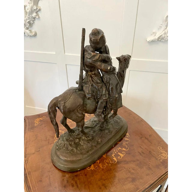 Antique victorian quality bronze figure of a cossack on horseback kissing his wife farewell with his sword and rifle at...