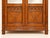 The two doors feature large beveled mirrors in their upper section, framed by fluted pilasters. The lower section is...